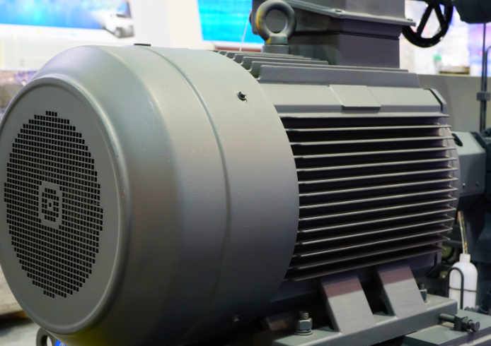 electric-motor-repair 11Close-up view of an electric motor system with wiring, components, and industrial machinery parts.