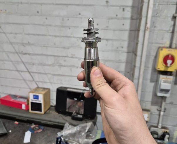 11Rocket rotor component undergoing dynamic balancing to improve performance and reduce vibration.