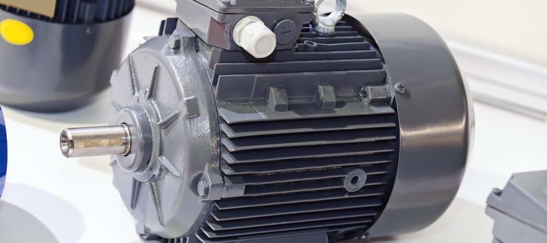 gray-electric-motor-on-white-background-indoors-2026-03-26-06-51-31-utc 11Servo motor displayed on a workbench during an industrial equipment inspection.